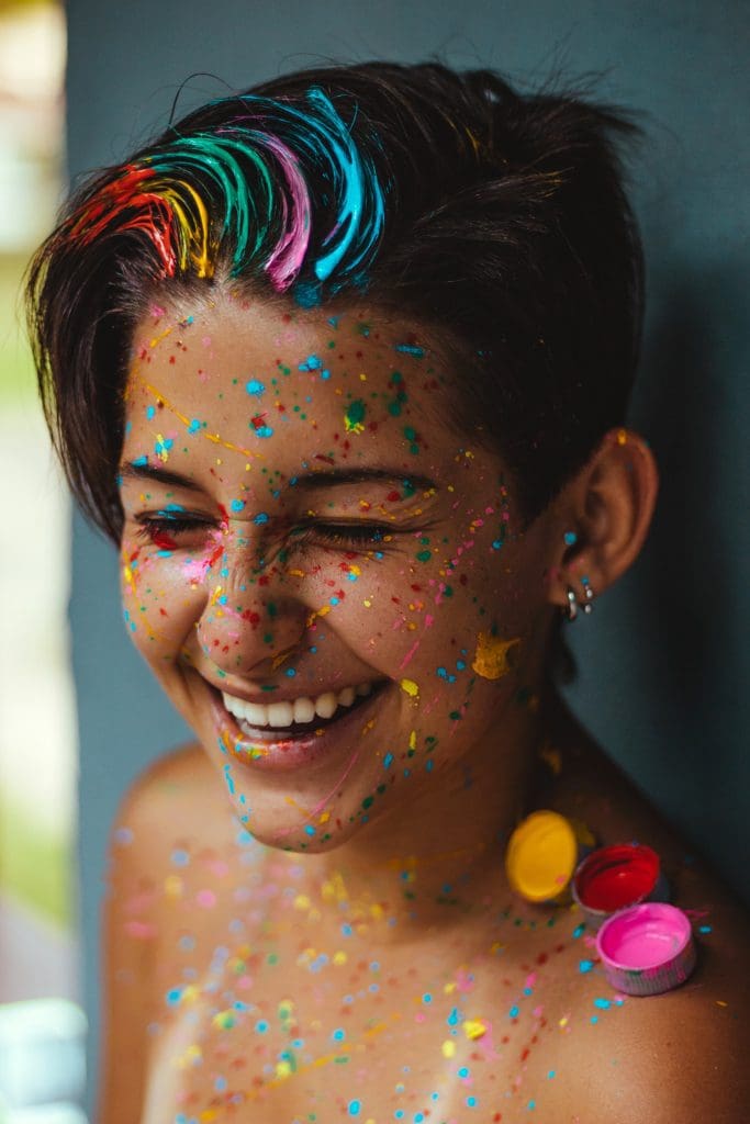 shallow-focus-photo-of-woman-smiling-with-face-paint-1882309